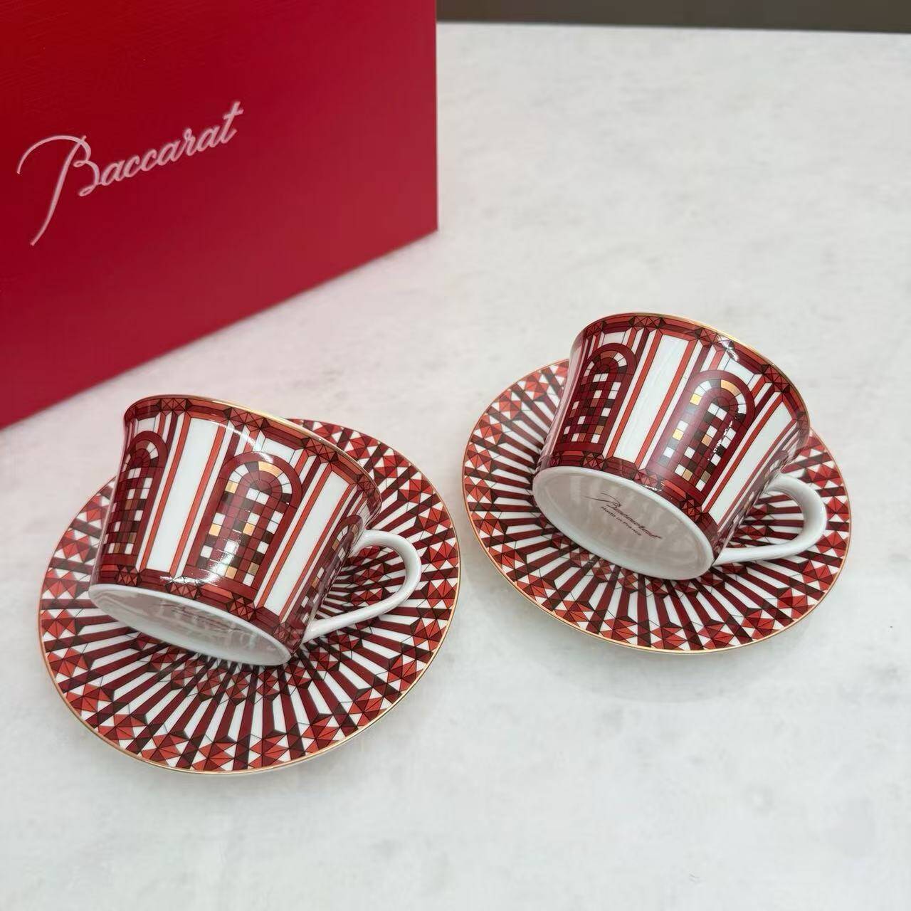 Pair of Baccarat Porcelain Coffee Cups and Saucers, Red Geometric Design