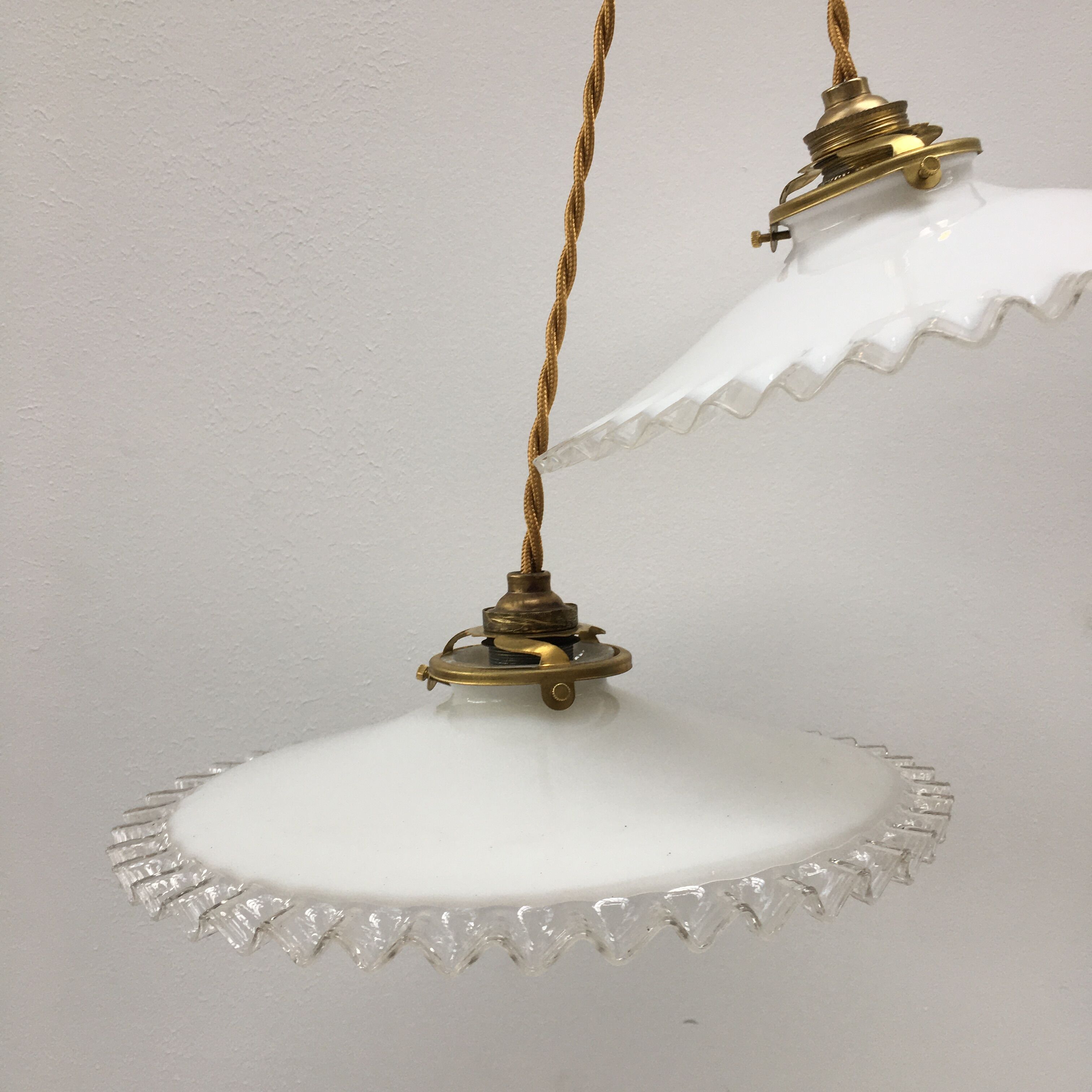 Pair of white opaline suspensions with serrated edges