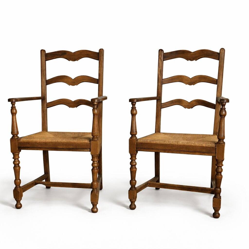 Pair of rustic antique armchairs in wood and woven straw.