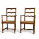 Pair of rustic antique armchairs in wood and woven straw.