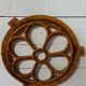 Cast iron ox's eye window in the shape of a flower