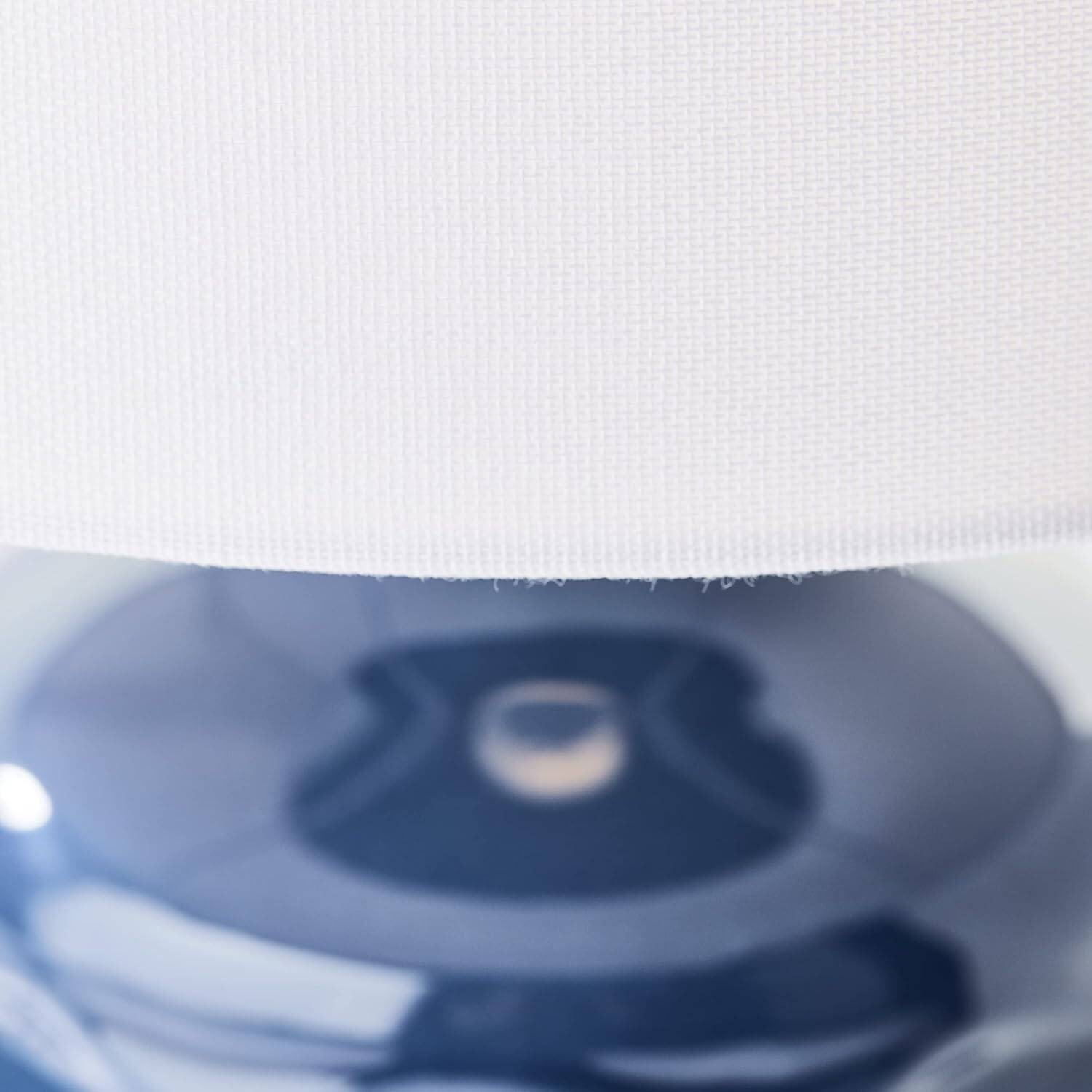 blue ceramic table lamp with white fabric shade