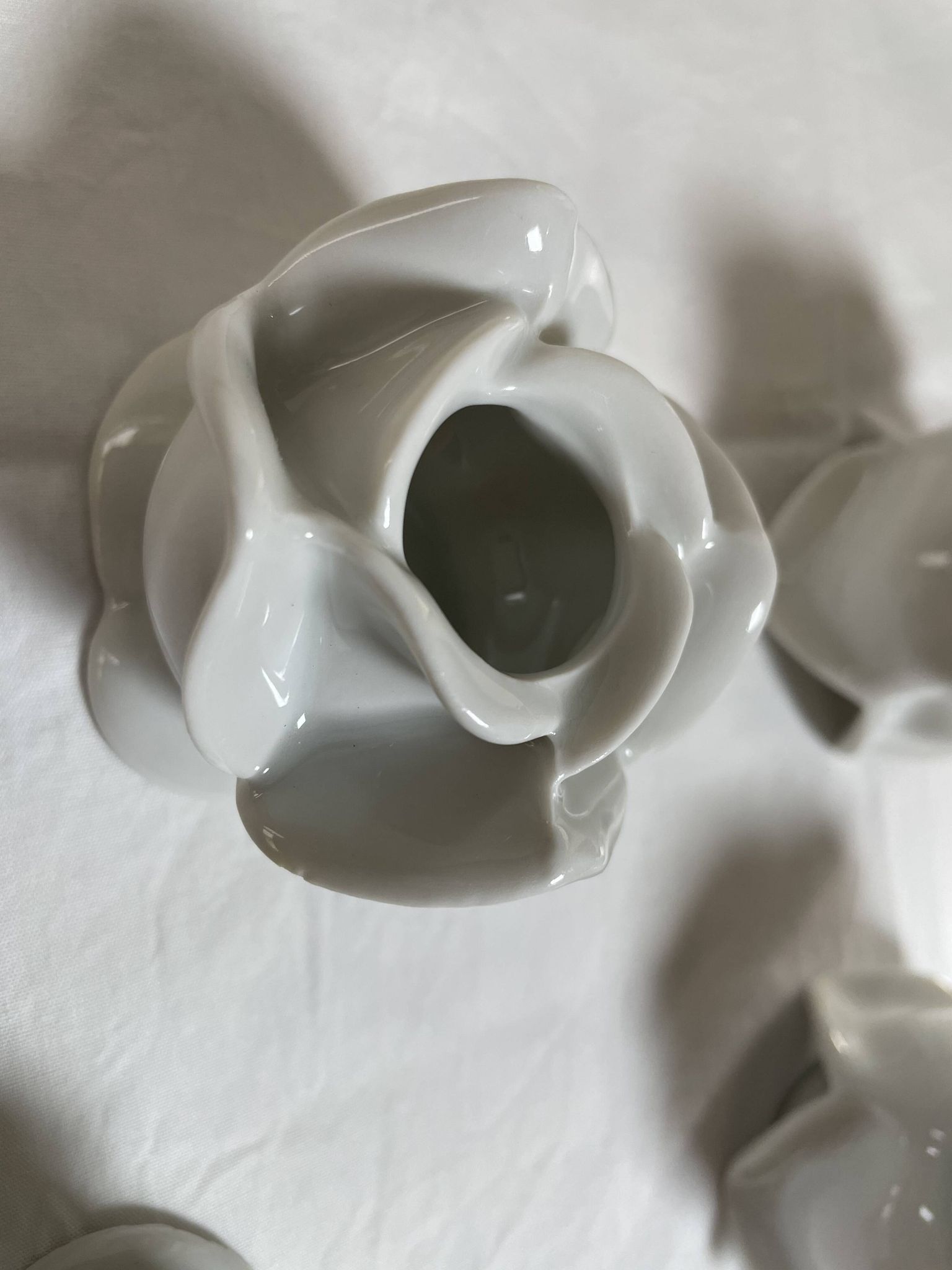 White porcelain rose shaped candle holders