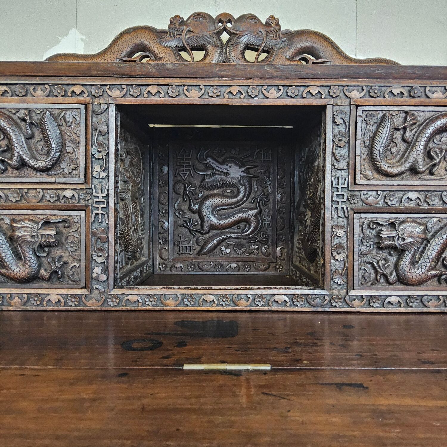 Antique 19th-century Chinese secretary with dragon woodcarving