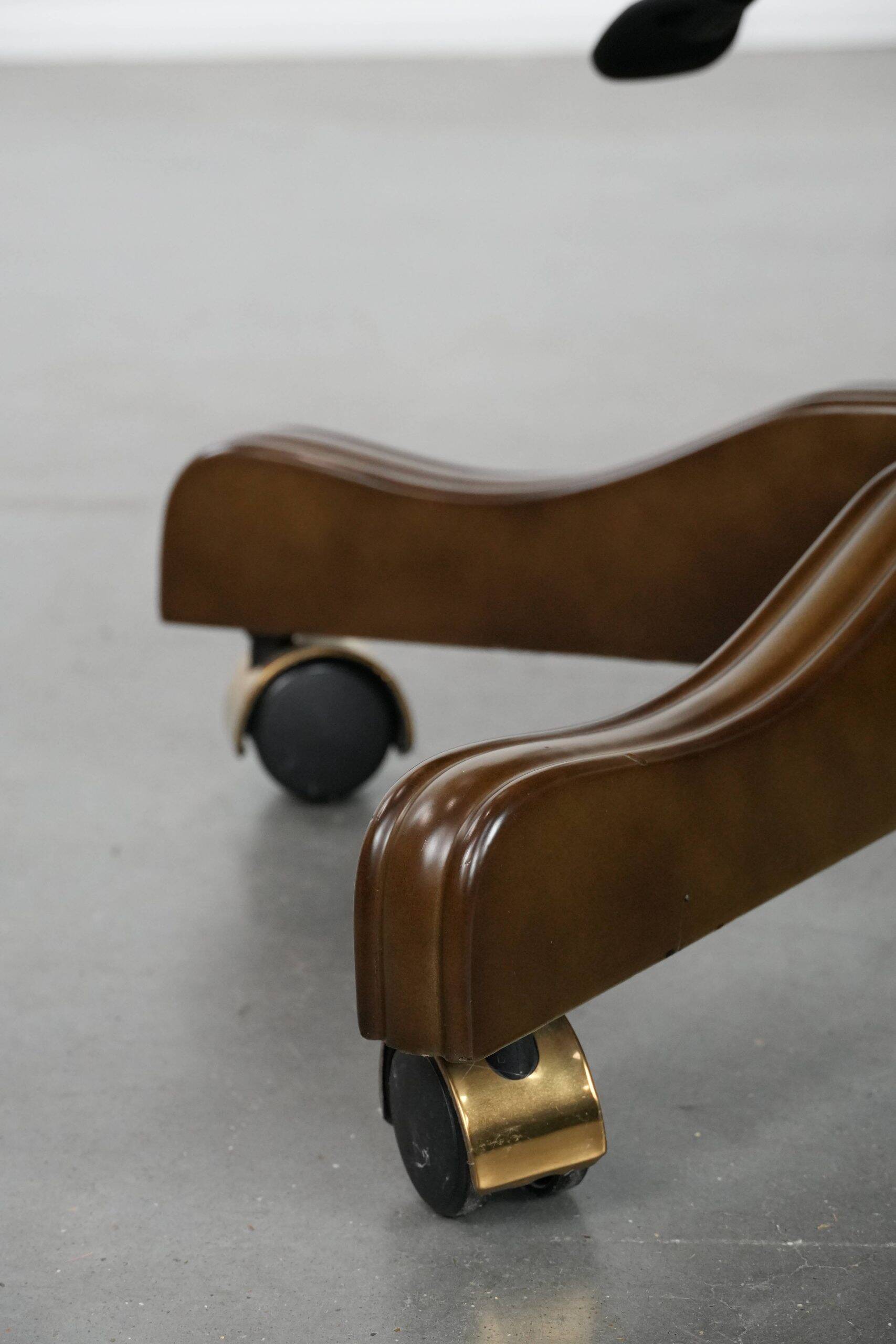 Chesterfield office chair in English style made of cow leather and wood.