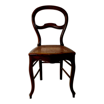 Antique chair sitting cannage