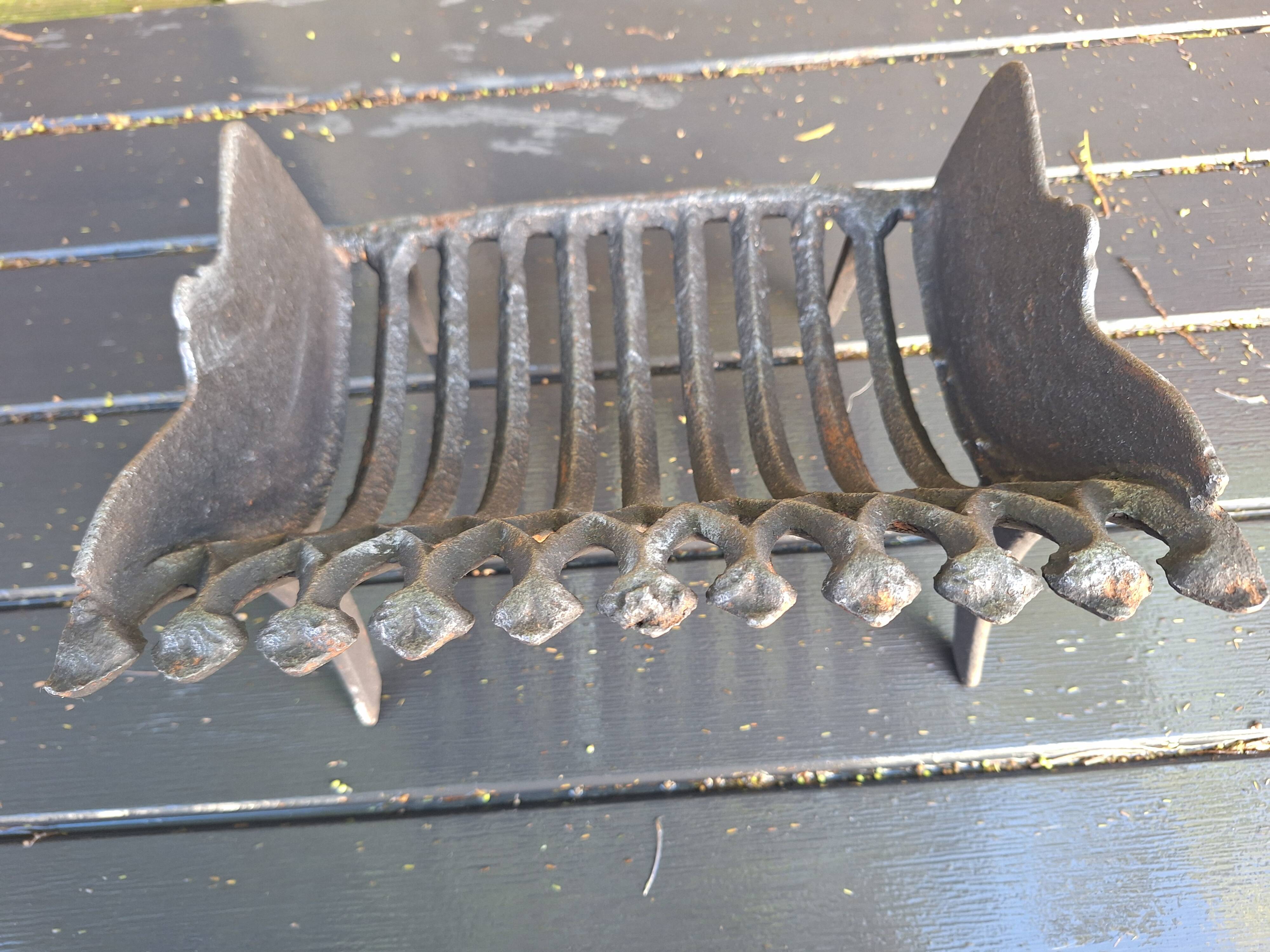 Antique cast iron log holder/ember holder for fireplace