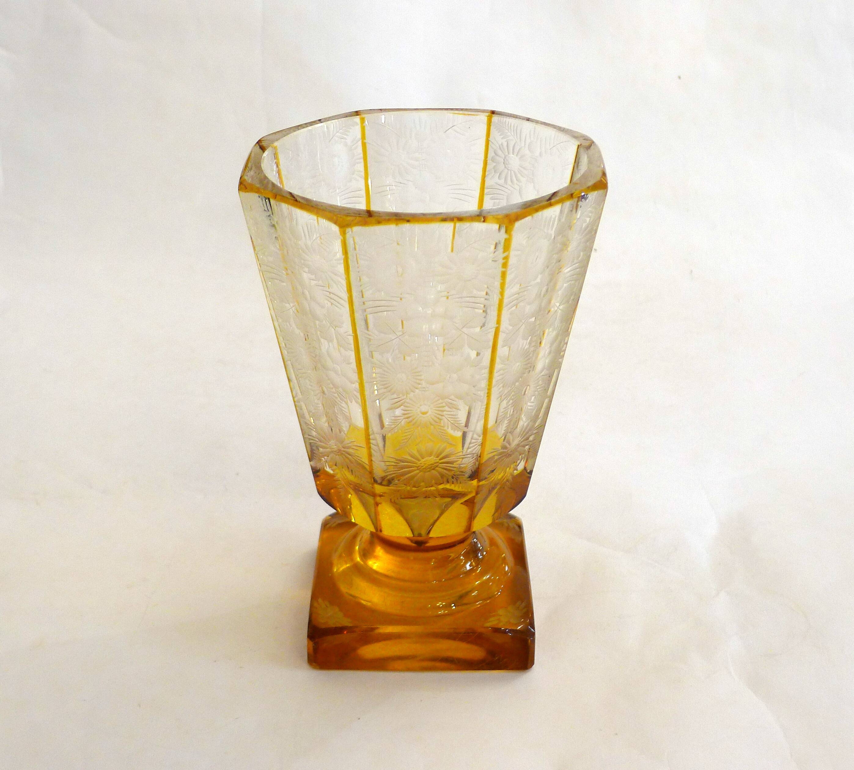 Art Deco vase engraved with flowers, faceted body on a pedestal.