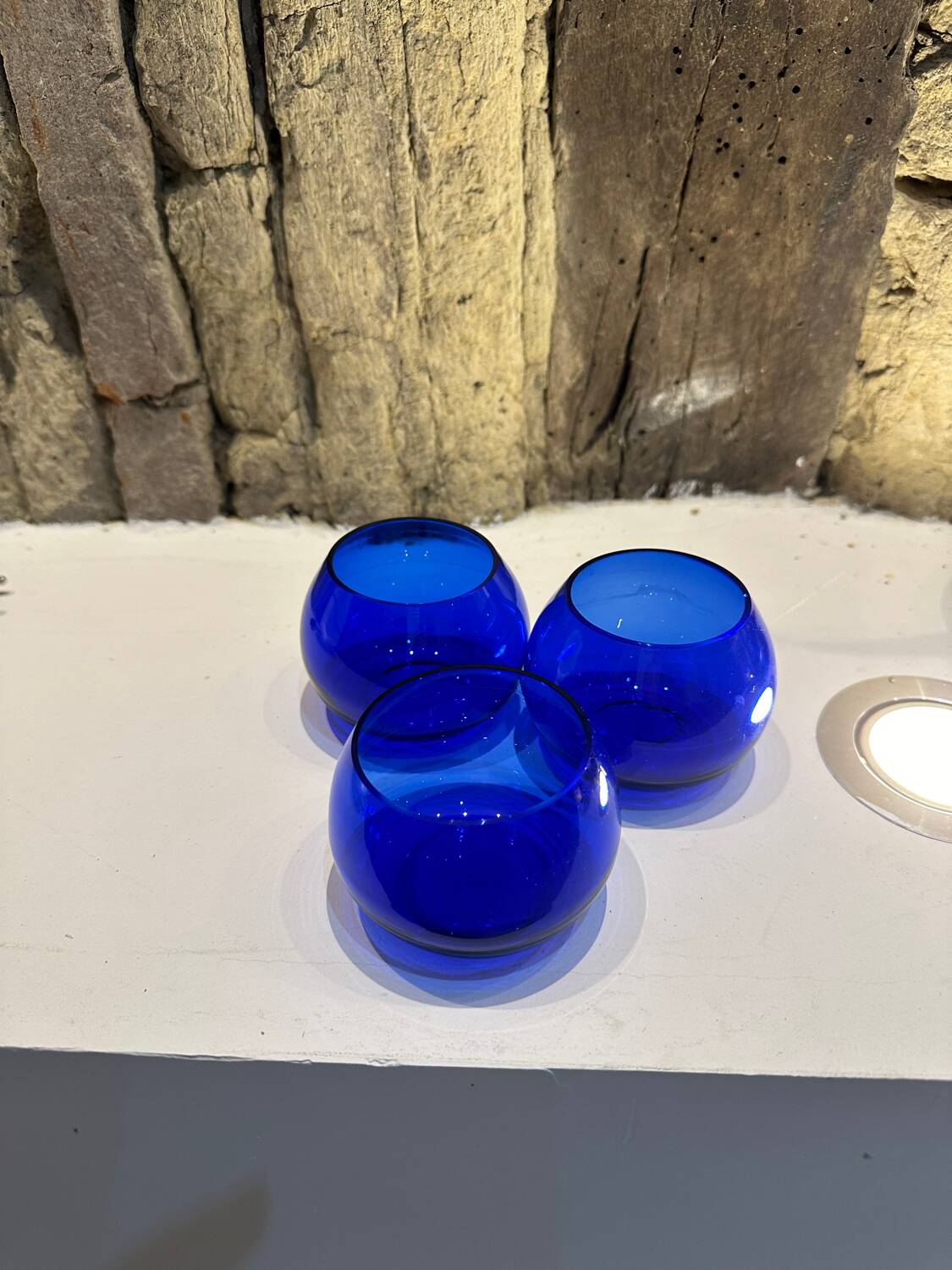 Set of 3 blue glass candle holders
