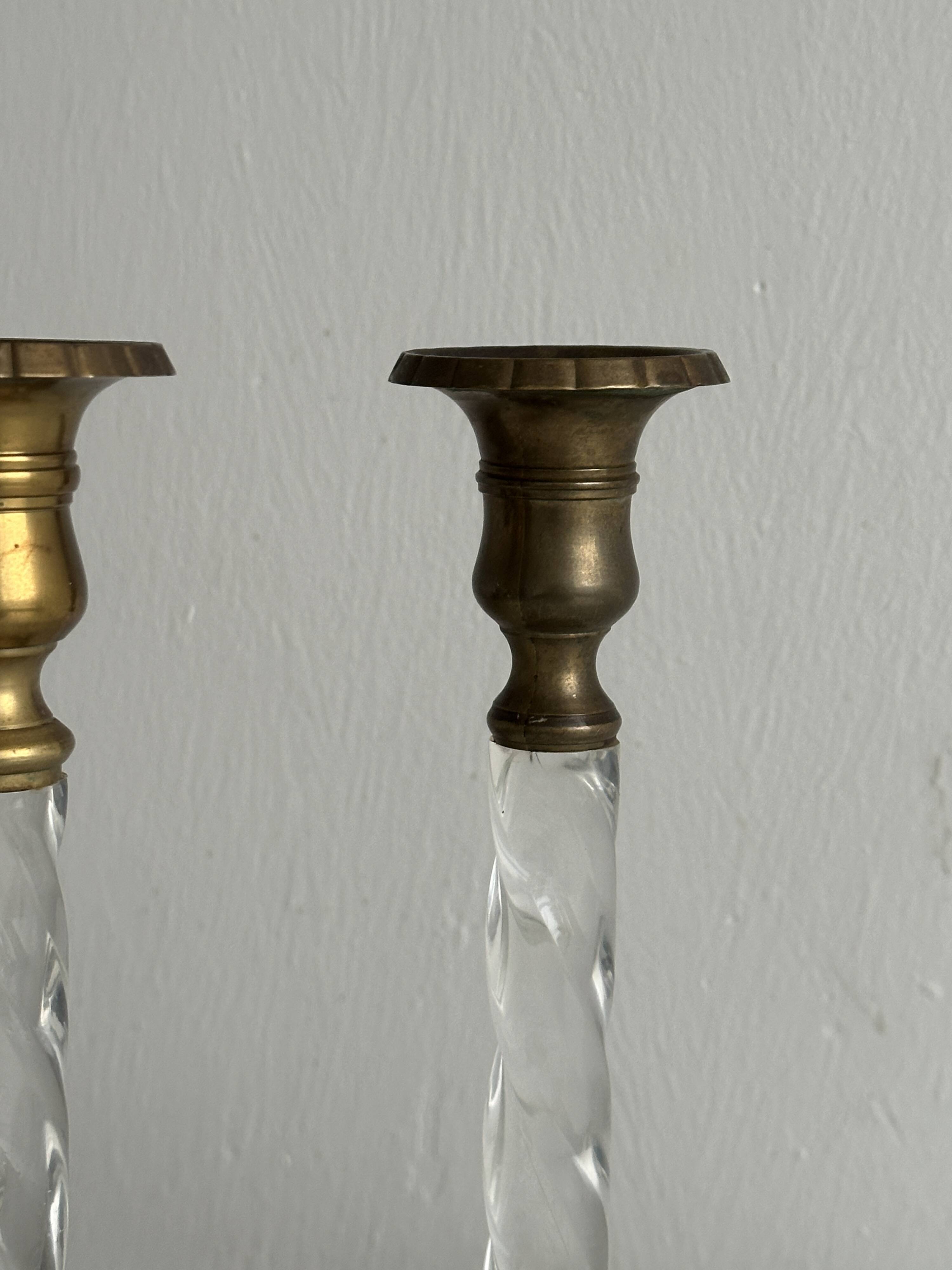 Pair of twisted metal and glass candlesticks