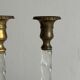 Pair of twisted metal and glass candlesticks