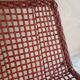 Modernist armchair in woven leather and black metal – 1960s–1970s