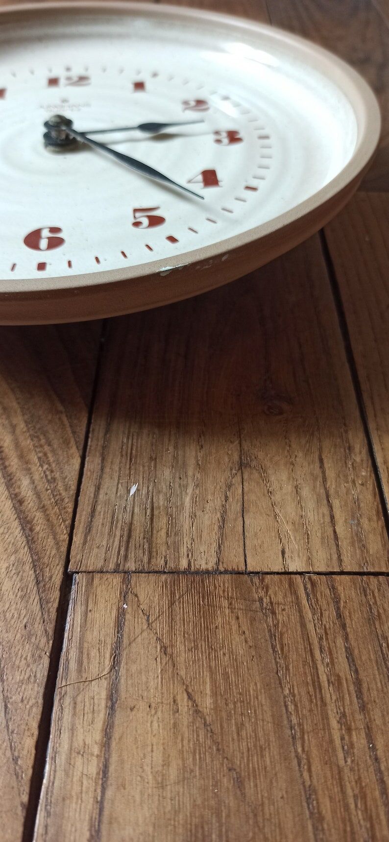 Clock in the shape of a round plate Junghans