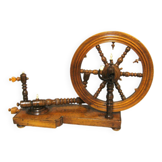 Old eighteenth-century salon spinning wheel.