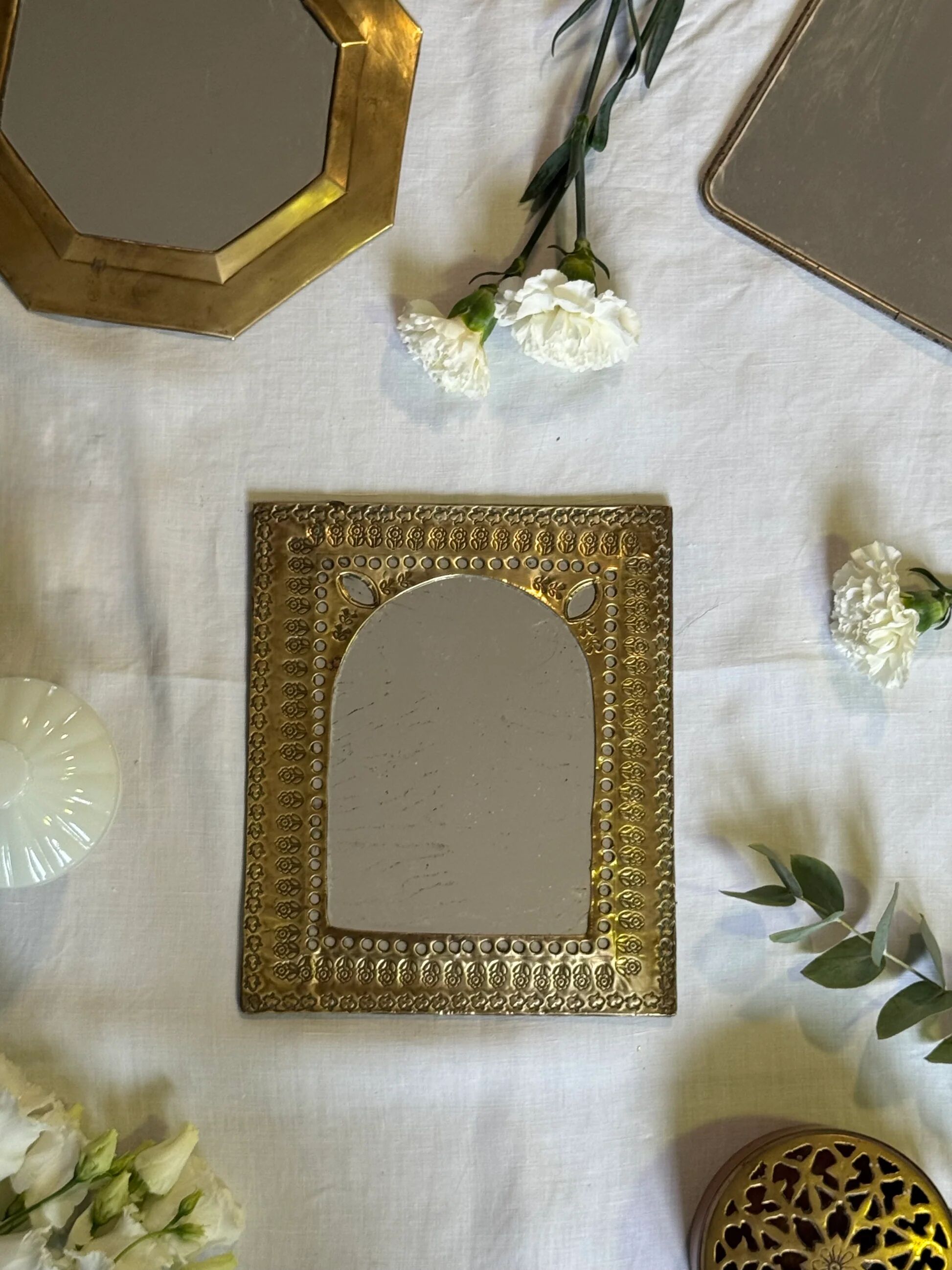 Oriental brass mirror