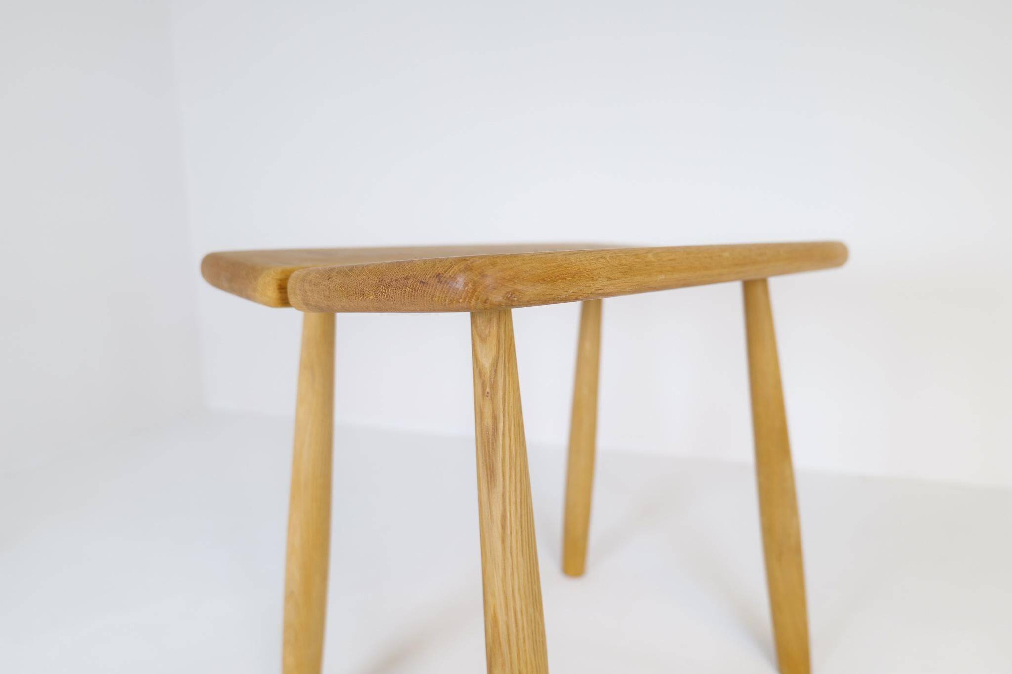 Sculptural mid-century stool in solid oak by Carl Gustaf Boulogner, Sweden, 1950s.