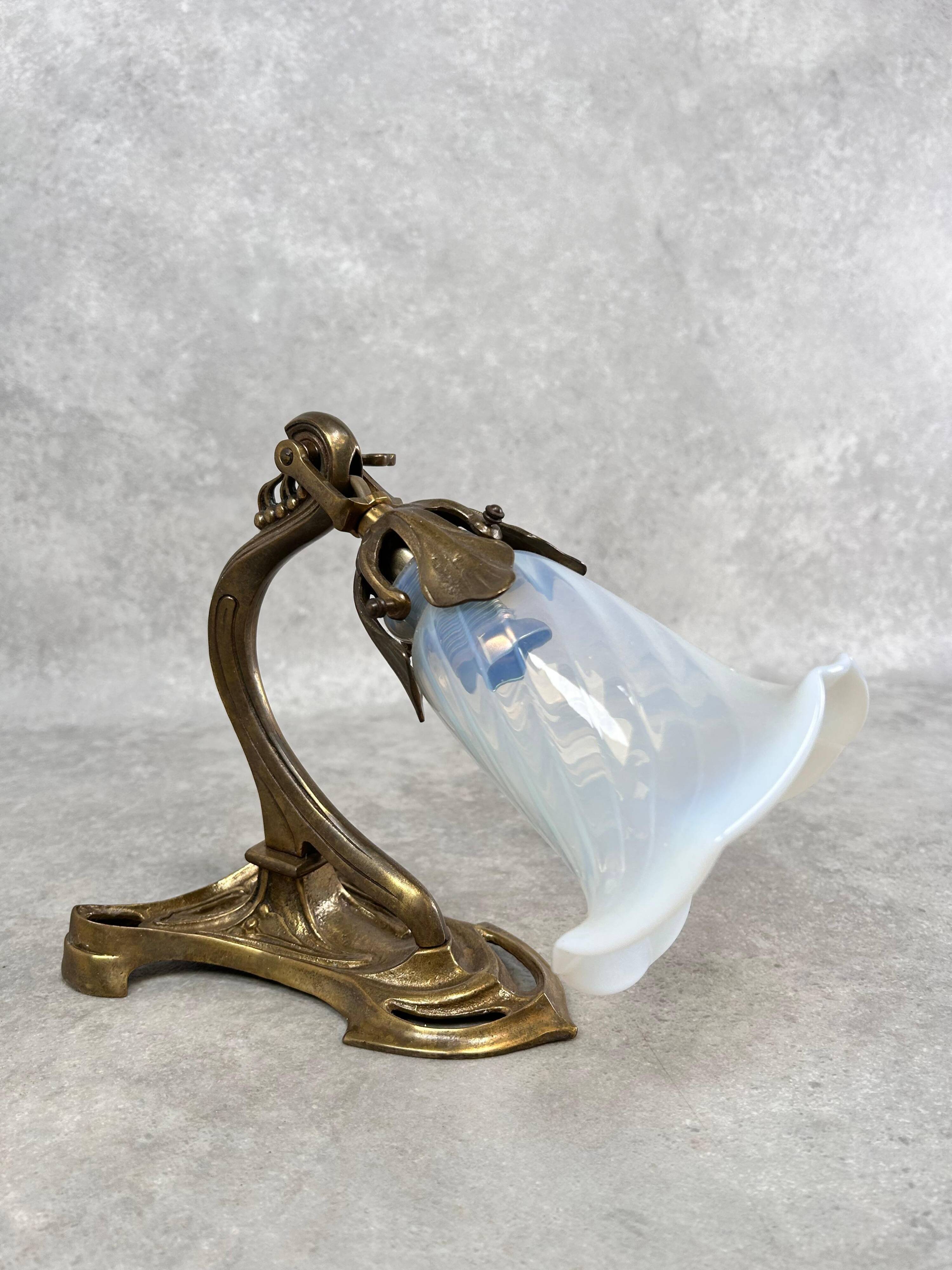 Art Nouveau wall sconces with opalescent iridescent glass