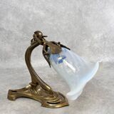 Art Nouveau wall sconces with opalescent iridescent glass