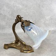 Art Nouveau wall sconces with opalescent iridescent glass