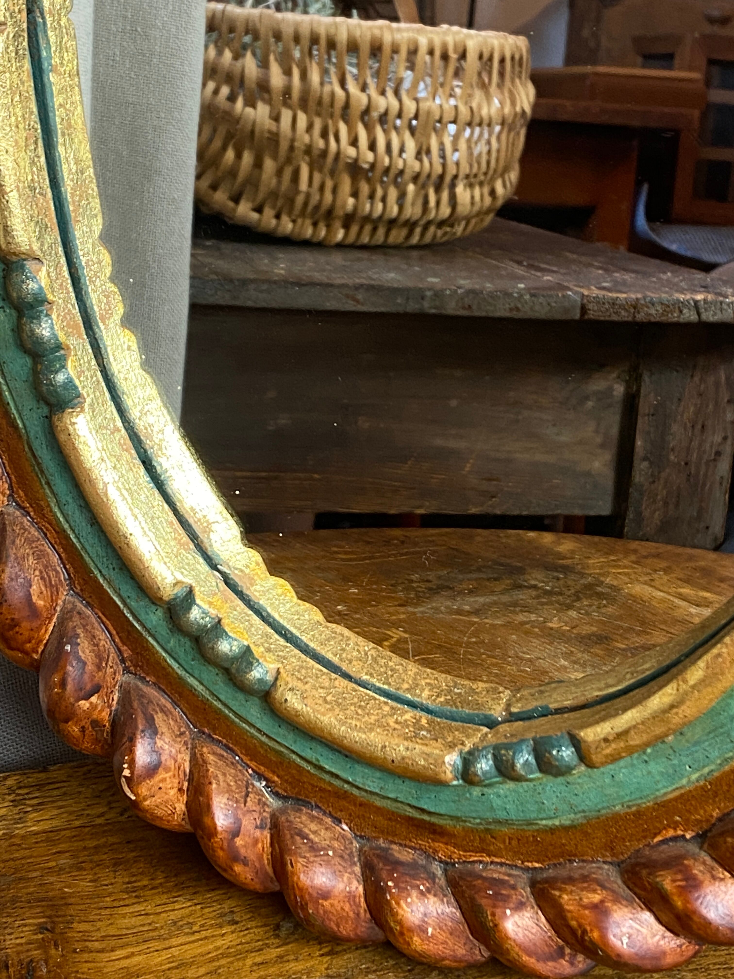 Oval mirror in carved wood