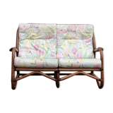 Rattan sofa with flower cushions
