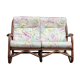 Rattan sofa with flower cushions