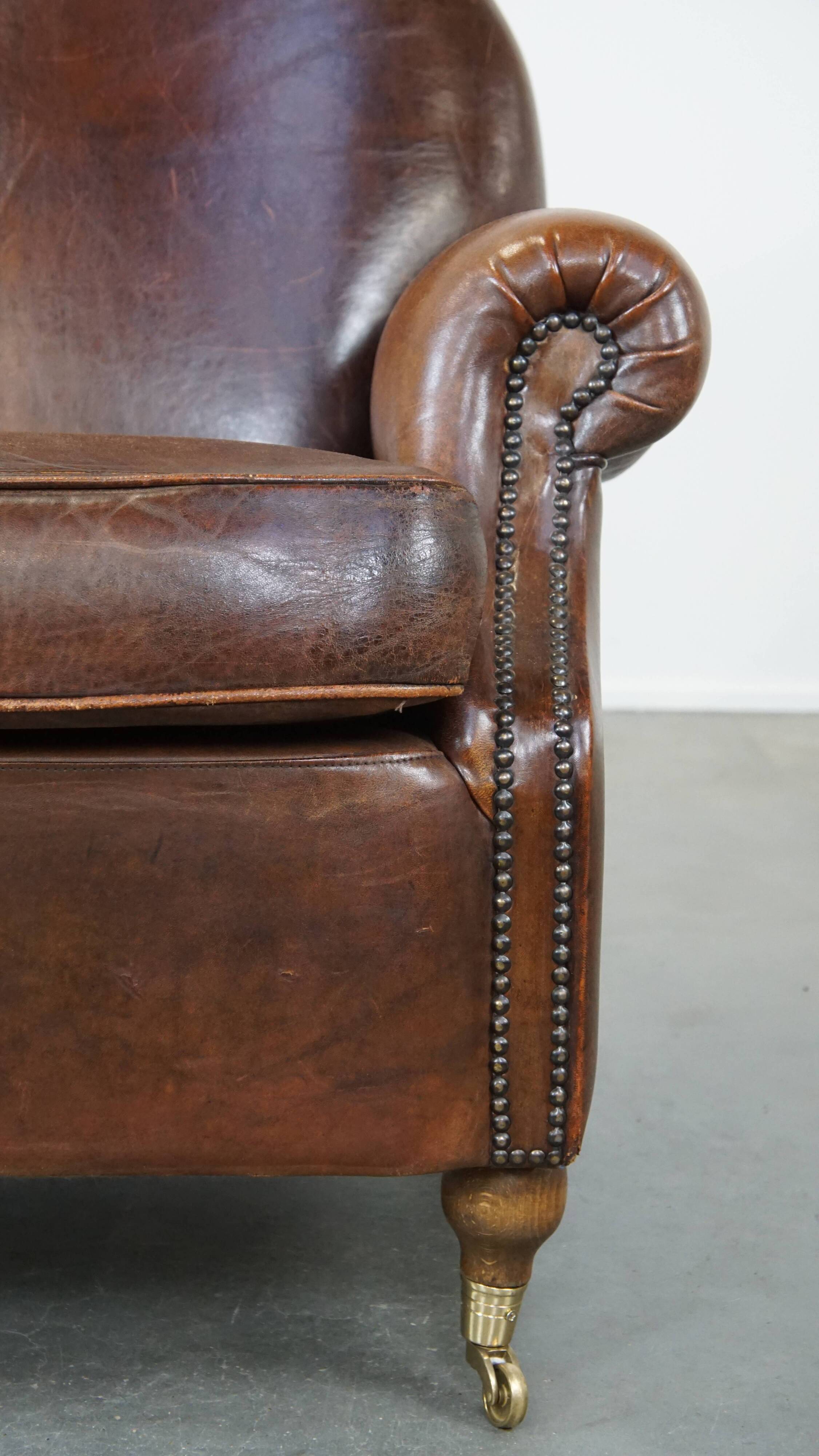 Sheep leather armchair on wheels