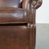 Sheep leather armchair on wheels