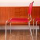 2 tubular chairs in red leather 1970