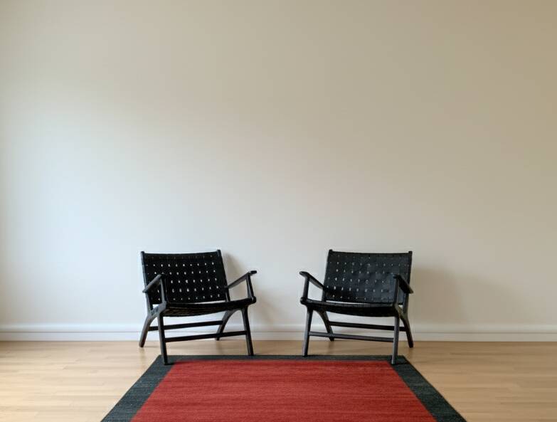 Two numbered black leather designer armchairs – Olivier De Schrijver