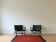 Deux fauteuils design cuir noir numérotés – Olivier De Schrijver
