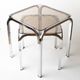 Pair of chrome nesting tables with smoked glass tops