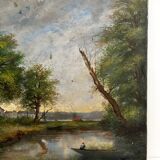 Old oil painting on canvas of a landscape by the pond.