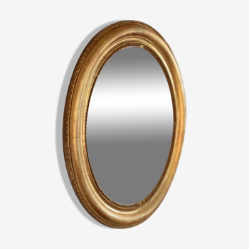 Miroir oval en bois doré fin 19ème