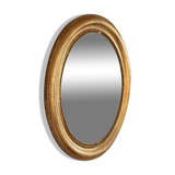 Oval mirror in gilded wood late 19th