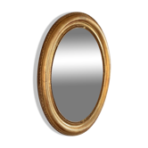 Oval mirror in gilded wood late 19th