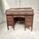 Vintage American wooden desk with a roll-top.
