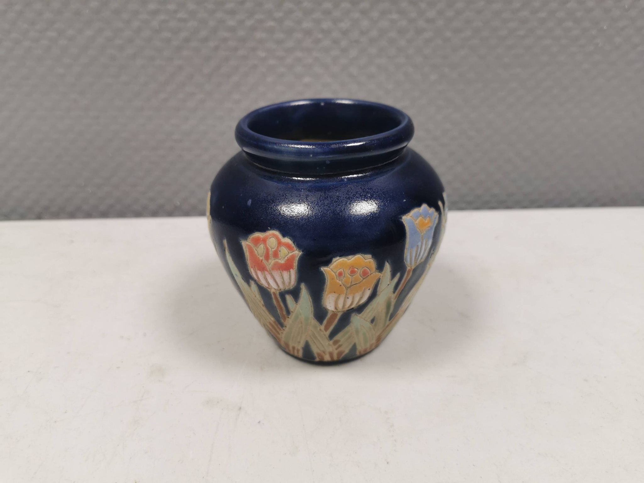 Small delicious blue ceramic vase with floral decoration. Sweden 1970s