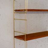 Wall-mounted shelf (Hylla) with brass structure