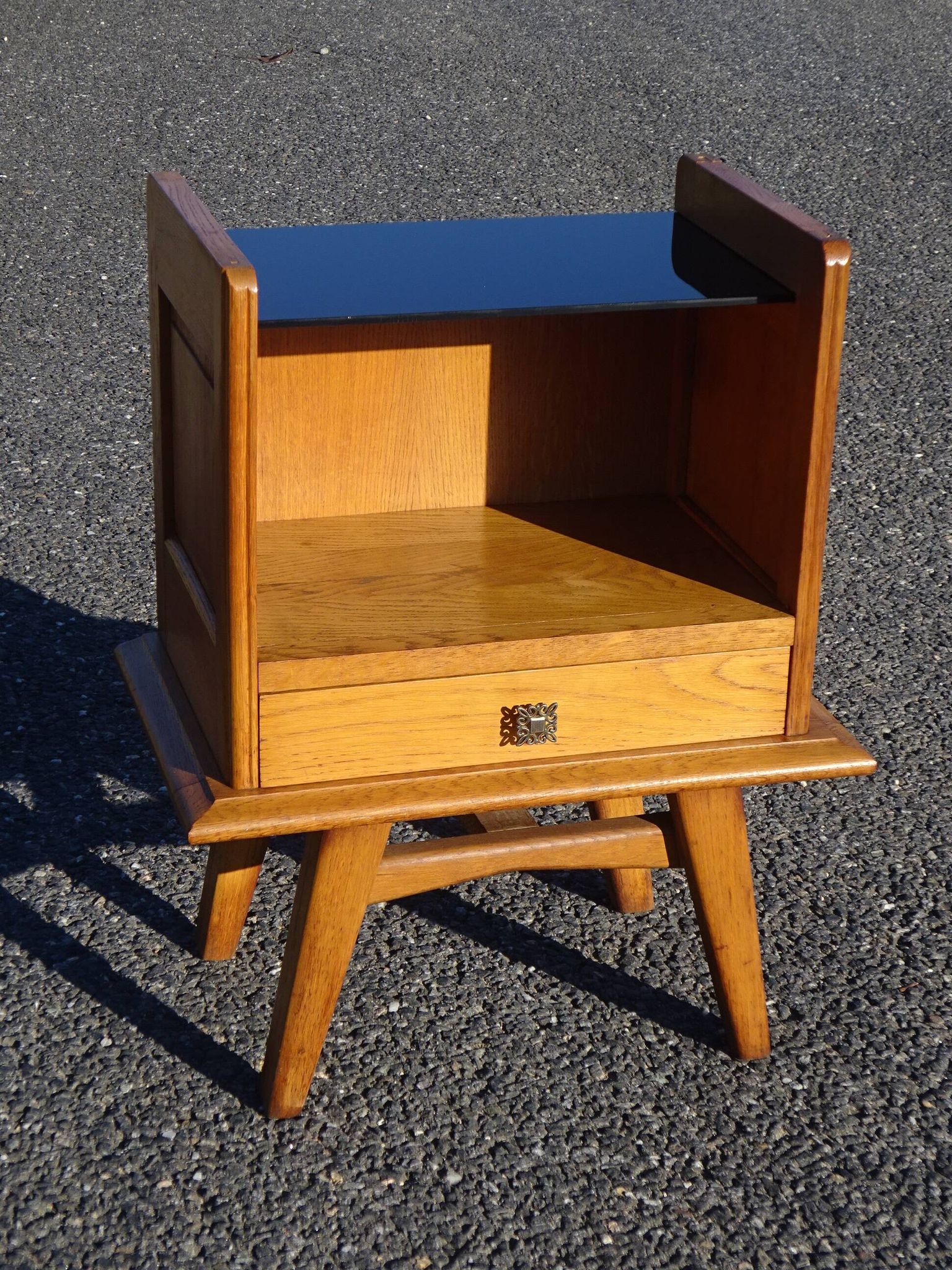 Vintage oak bedside table with tapered legs.