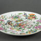 Porcelain plate of Canton XIXth decoration of butterflies and bird