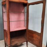 Louis xv showcase with a marble door