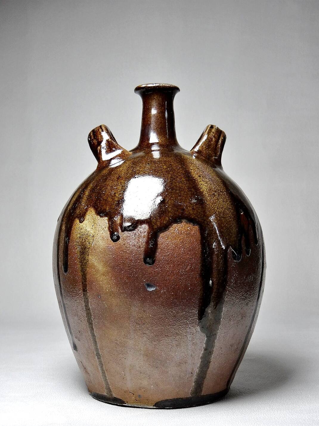 Old stoneware oil jar, glazed and enamelled, 2 handles