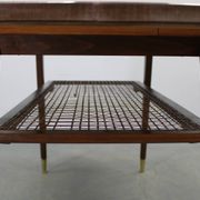 Mid-century German coffee table with rattan shelf and brass legs
