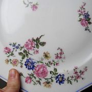 4 flat plates by Bernardaud, Limoges porcelain, floral decoration from the 1920s to 1950s.