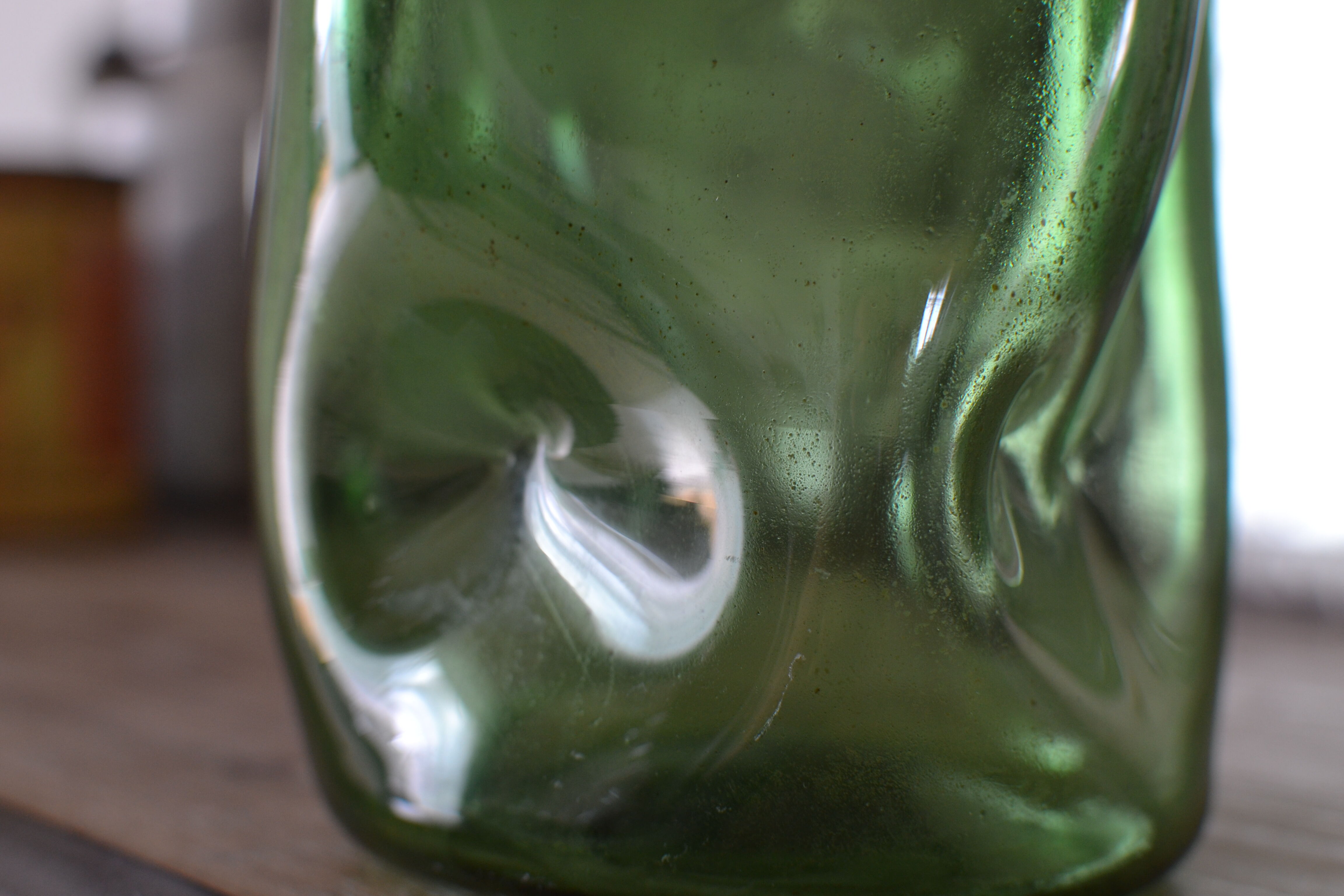 Dented green bottle