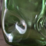 Dented green bottle