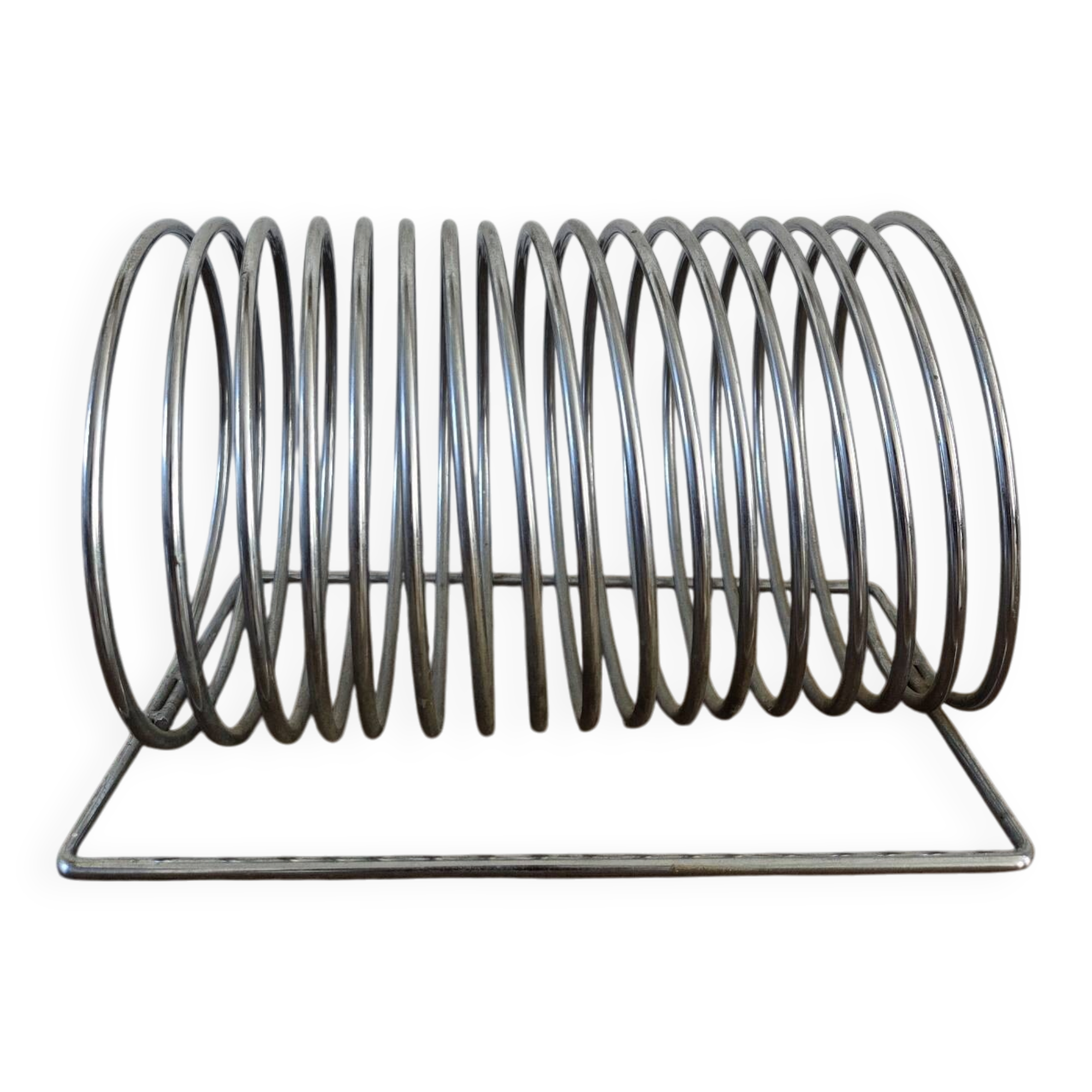Chrome spring magazine rack, 1970