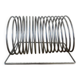 Chrome spring magazine rack, 1970