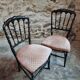 Pair of antique Napoleon III chairs in blackened wood and fabric.